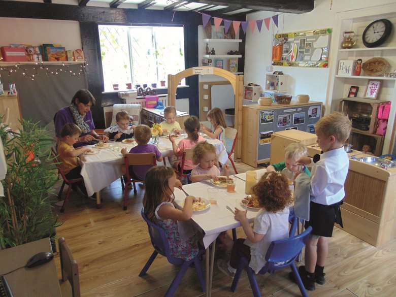 Mealtime at Townhouse, where cook Wendy Pullizzi (below) works with children, parents and the wider community