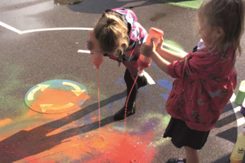 Experimenting with paint in the playground