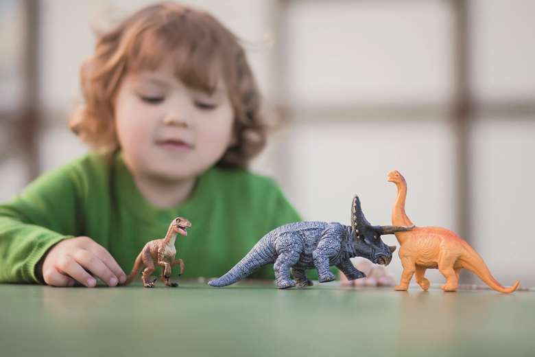 Dinosaurs and vehicles are classic small-world props