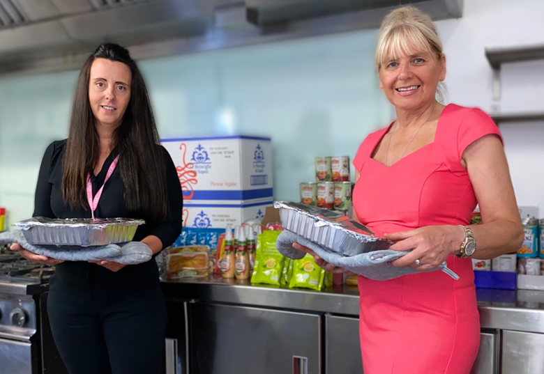 Gemma Fletcher, nursery manager Media City with a recent food bank donation from Morrison's, Swinton, and a sample of prepared meals for local families