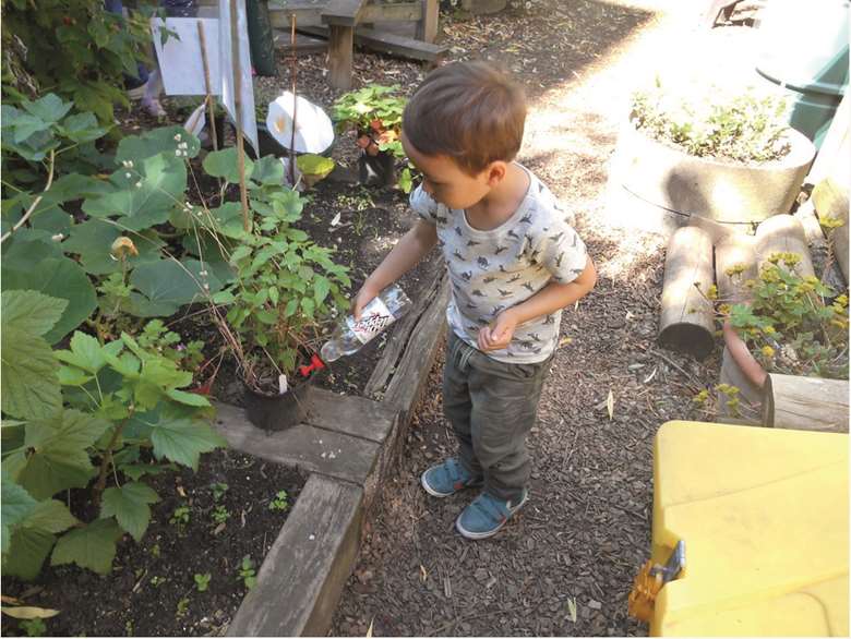 The children are hands-on in the garden, from planting vegetables to harvesting them