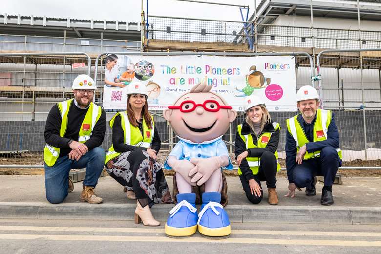 Left to right: Noel Hammett (Hinton Group construction director) with The Midcounties Co-op's Sally Bonnar (chief operating officer), 'Little Pioneer' Charlie, Emily Sandilands (growth and acquisitions manager) and CEO Phil Ponsonby 