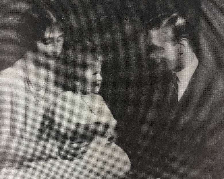 Queen Elizabeth II with her parents, the future Queen and King George VI, published in The Nursery World