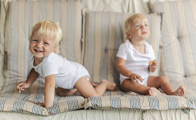 Sofas are not just for relaxing on when it comes to encouraging young children’s physical development