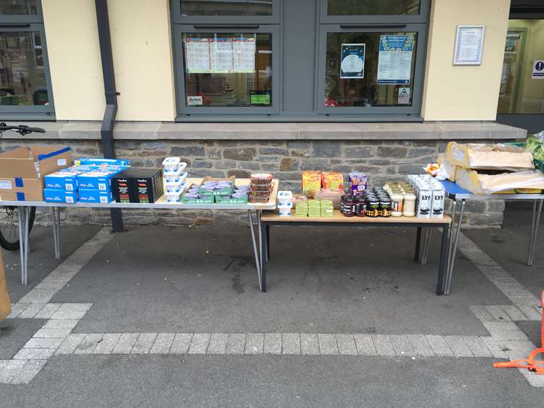 A weekly stall offering cereal, milk, pasta and fresh produce set up in a primary school playground. PHOTO: William Baker, University of Bristol